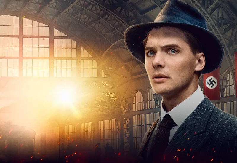 "Fuga da Alemanha". Em 1939, Hitler fechou as fronteiras, prendendo 85 missionários americanos que serviam na Alemanha. Sua fuga dramática da Alemanha nazista foi um evento importante na história da igreja moderna. Legenda descritiva disponível. Com Paul Wuthrich, Sebastian Michael Barr, David McConnell, Landon Henneman, Brad Witbeck, Scarlett Hazen, Trystyn Roberts, Kevin Kirschenmann e Bruce Newbold.